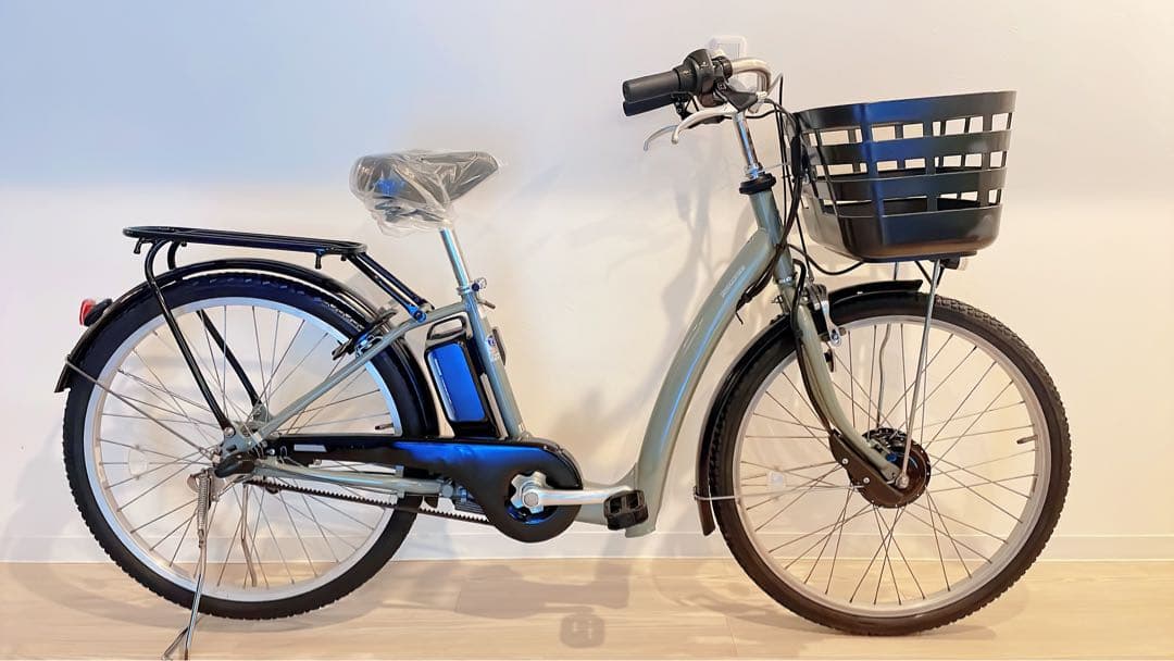ブリヂストンの電動アシスト自転車、26インチ、ターコイズ。